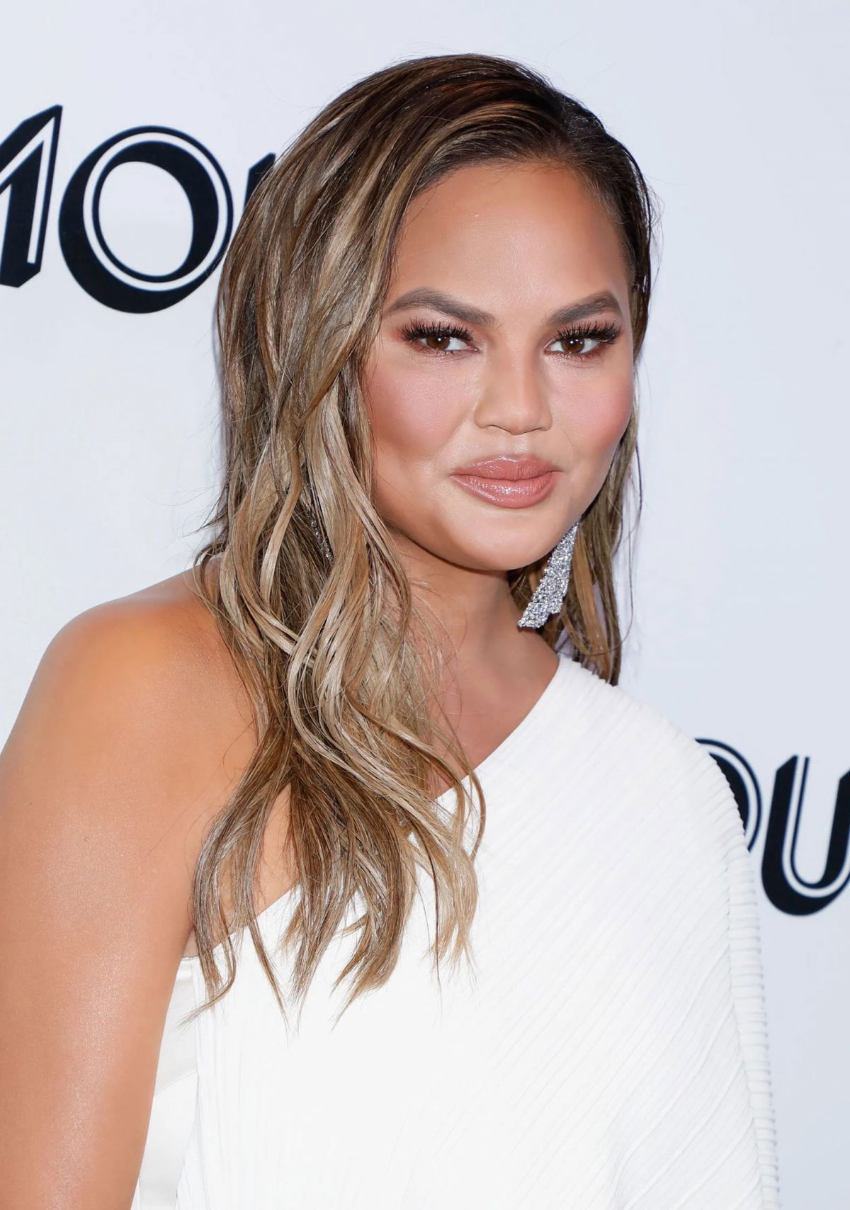 Chrissy Teigen, Hair, Nose, Joint, Skin, Head, Lip, Chin, Eyebrow, Shoulder, Eye