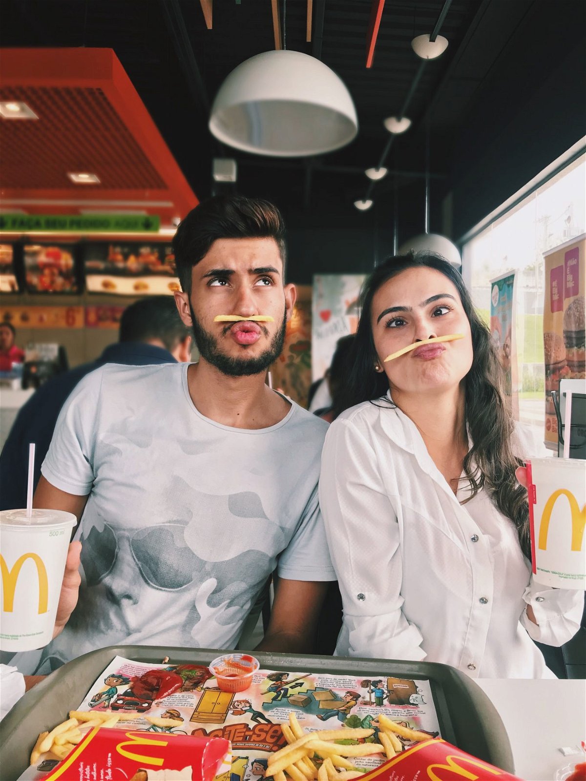 Couple in McDonald's, Goofy Faces