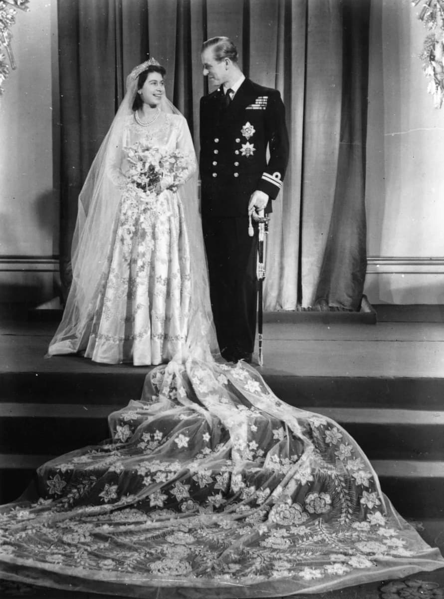 Queen Elizabeth Wedding Dress, Clothing, Wedding dress, Outerwear, Photograph, Bride, White, Bridal veil, Dress, Black, Flower