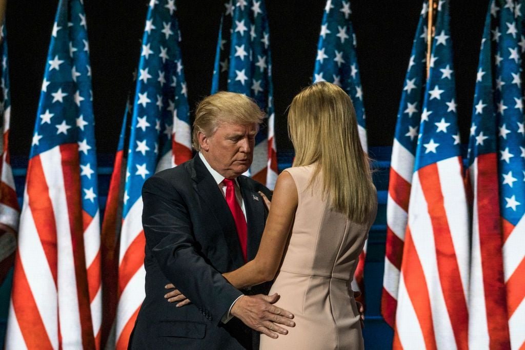 Trump And His Daughter, Outerwear, Photograph, Coat, Flag, Flag of the united states, Microphone, Tie, Gesture