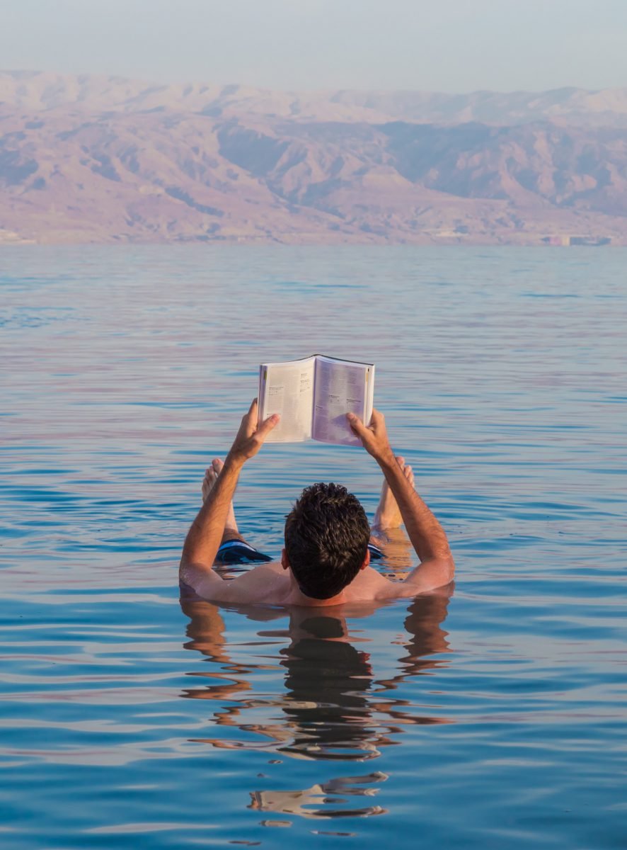 Floating In The Dead Sea Reading A Book, Water, Sky, Arm, Azure, Body of water, Lake, Happy, Gesture