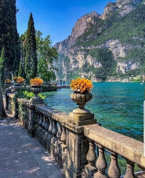 Riva Italy, Water, Sky, Plant, Water resources, Mountain, Daytime, Azure, Nature, Natural landscape, Flowerpot